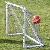 3. An image of a soccer goal featuring a ball positioned on the ground.